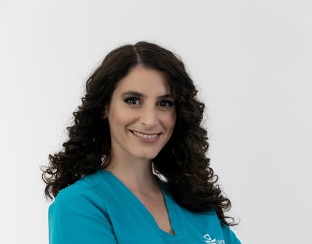 Nurse assisting disabled person